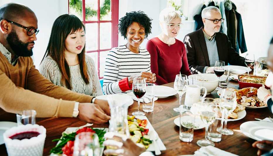 A family sitting around a table having dinner