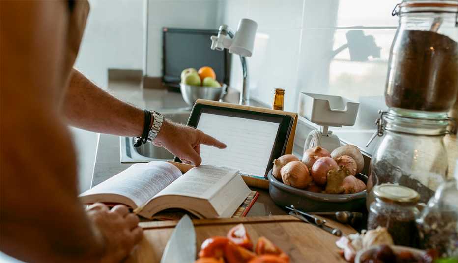 woman following a recipe listed on a tablet
