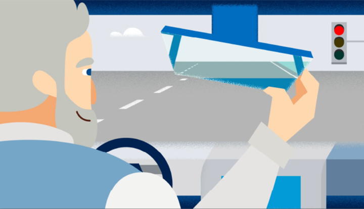 Graphic of a man adjusting the rear view mirror