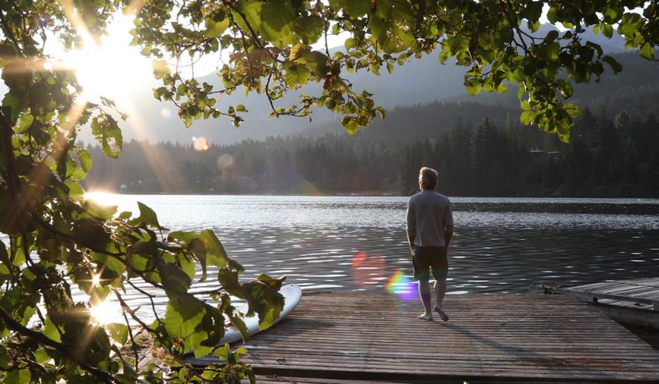 Man looking at a lake