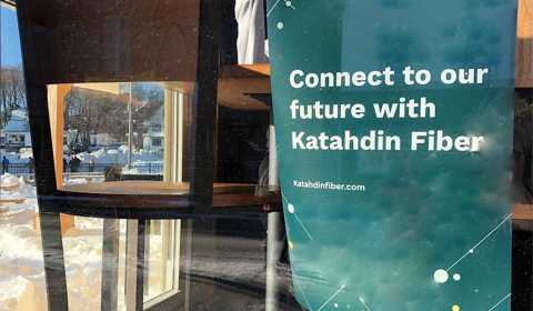 A poster in a Millinocket, Maine, restaurant window advertising high-speed internet