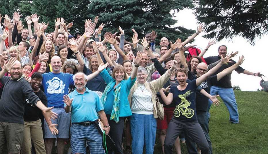 Group Portrait Of Smiling Men And Women Waving Hands, Outdoors, Biking And Walking Report, Livable Communities Group Portrait Of Smiling Men And Women Waving Hands, Outdoors, Biking And Walking Report, Livable Communities