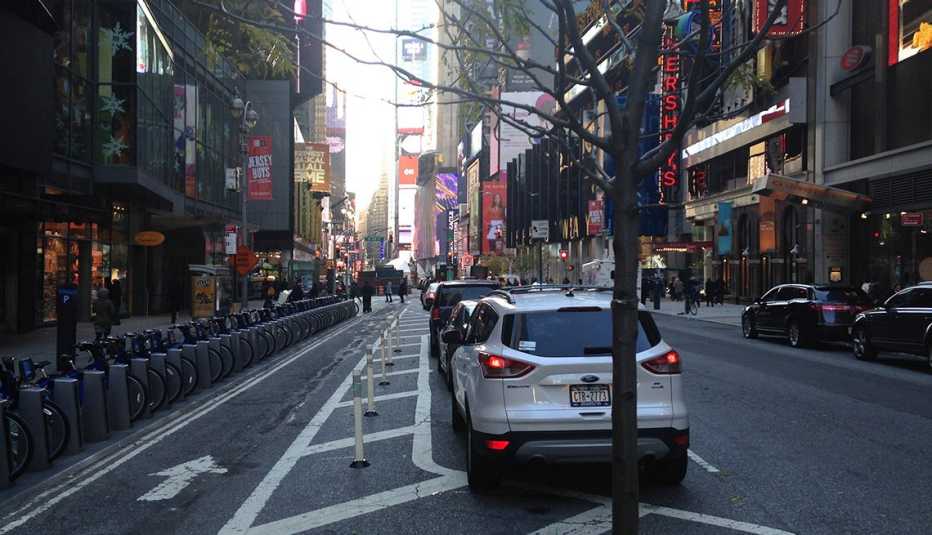 A Dedicated Bike Lane Situated Between Street Parking Filled With Cars And Sidewalks With Crosswalks, Downtown, City, New York, Livable Communities, Biking Infrastructure
