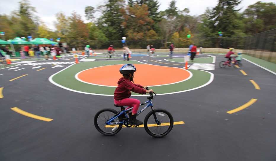 A child practices riding a bicycle in a Bike Safety Park near Seattle, Washington