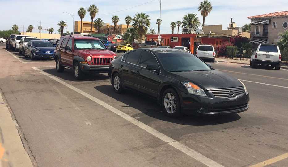 Cars parked away from the curb create a protected bike plane in Phoenix, Arizona