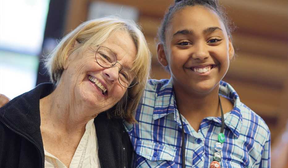 An older woman and teenage girl are neighbors in the Bridge Meadow Housing community