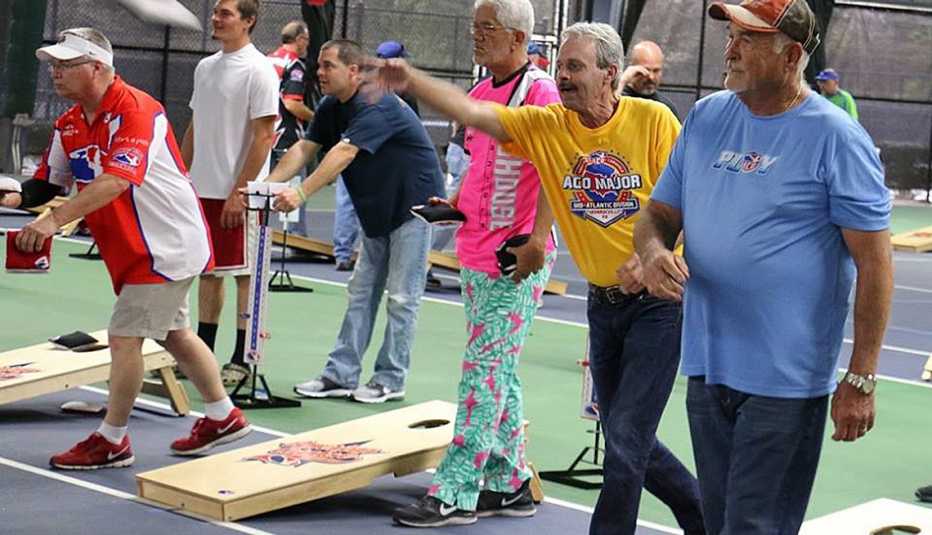 Elderly And Mature Men Play Cornhole, Game, Age Friendly Games, Livable Communities Elderly And Mature Men Play Cornhole, Game, Age Friendly Games, Livable Communities