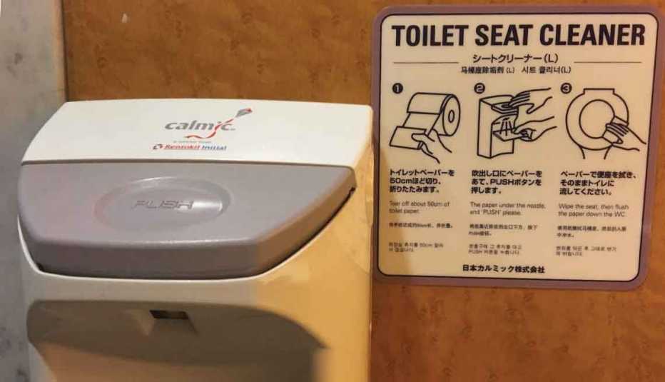 Toilet seat cleaning instructions in a public rest room.