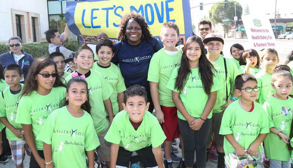 Fontana Mayor Acquanetta Warren joined by children participating in the annual Let’s Move on the Trail Event