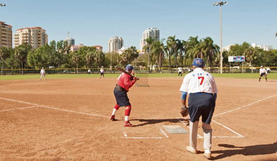 A batter at home plate during a Kids and Kubs softball game