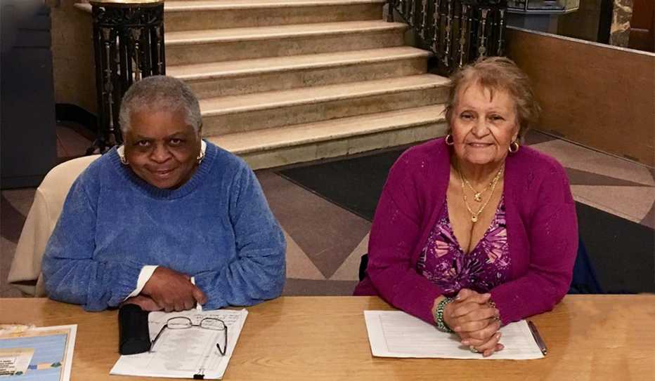 Two women volunteer as City Hall greeters in Medford, Massachusetts Two women volunteer as City Hall greeters in Medford, Massachusetts