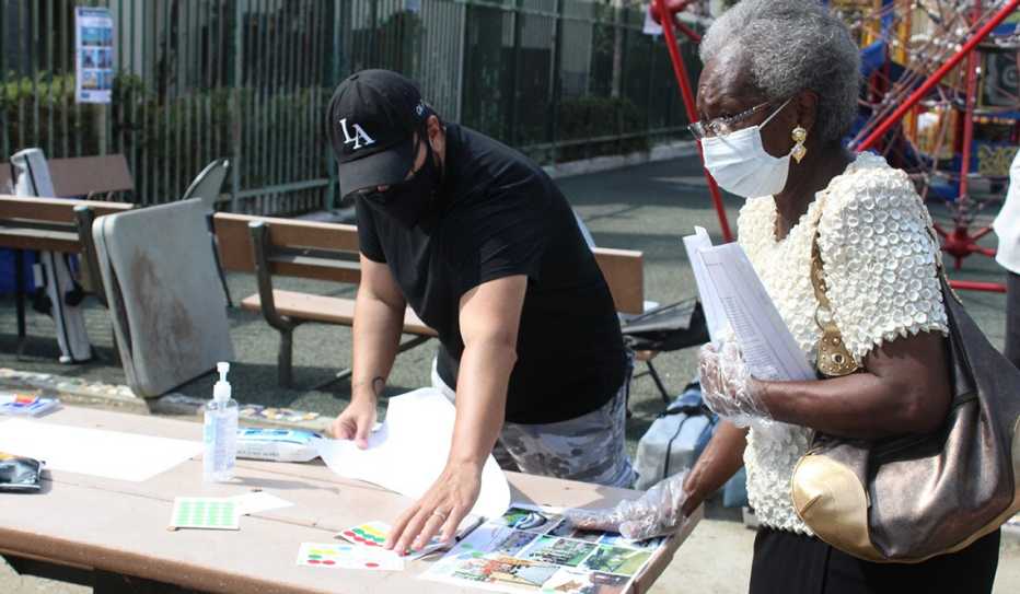 Jonathan Pacheco Bell and a neighborhood resident