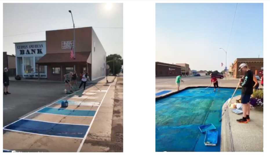 Community volunteers paint a demonstration crosswalk and curb extension. 