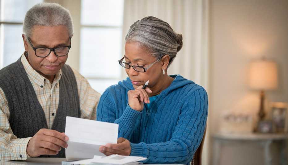 older couple paying bills