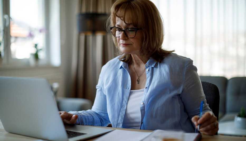 woman researching on her laptop