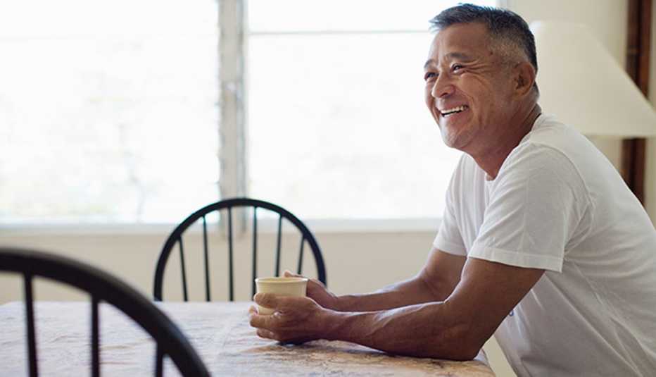 Asian Man, Dining Table, Medicare Open Enrollment Quiz