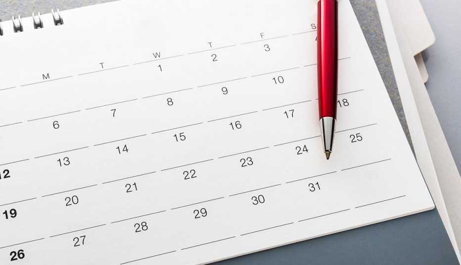 monthly calendar with pen