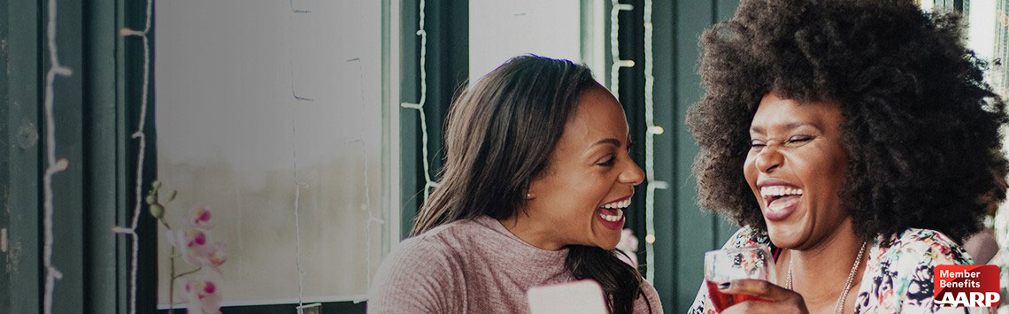 two women laughing in restaurant