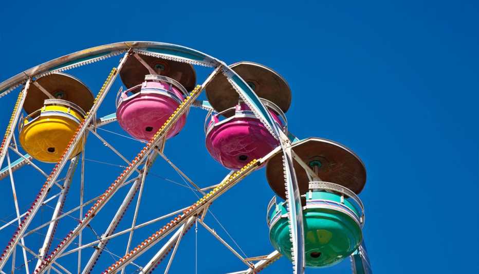 Colorful ferris wheel with blue sky in the background