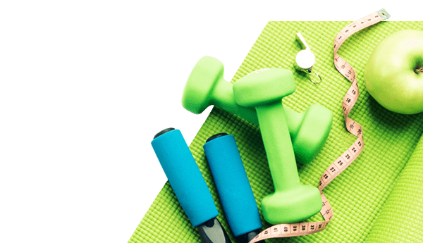 Workout gear and healthy snack on a yoga mat