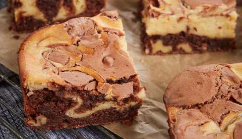Sliced chocolate brownies with cream cheese swirls