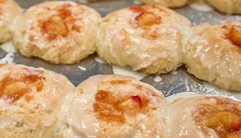 two rows of garth's peach kolaches on a tray