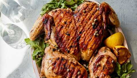 Chicken with lemon and herbs on dish