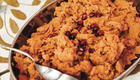 sweet potatoes in bowl with spoon in it