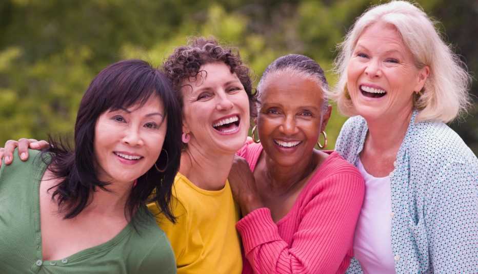 Four women smiling together