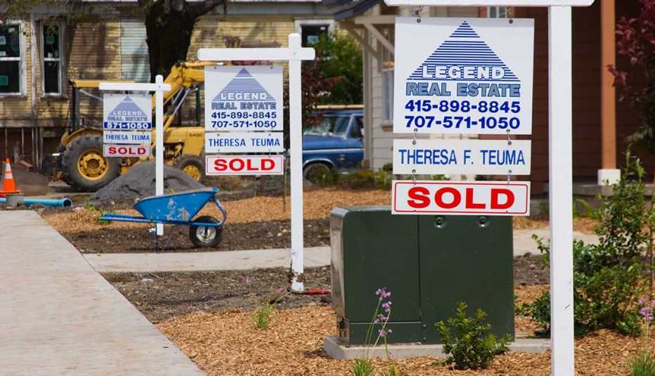 Real Estate signs indicate newly built homes that were sold before construction was completed in Santa Rosa California