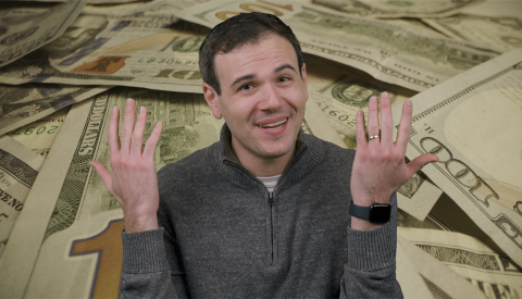 How to find unclaimed money a man holding his hands up with money behind him