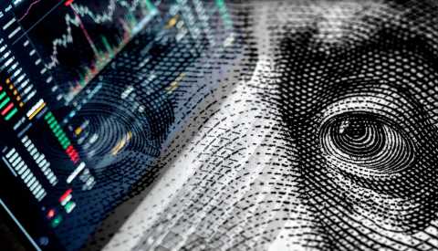 A macro close view of the black and white engraving on a cash bill with an overlay of a digital stock market indicator chart  A macro close view of the black and white engraving on a cash bill with an overlay of a digital stock market indicator chart
