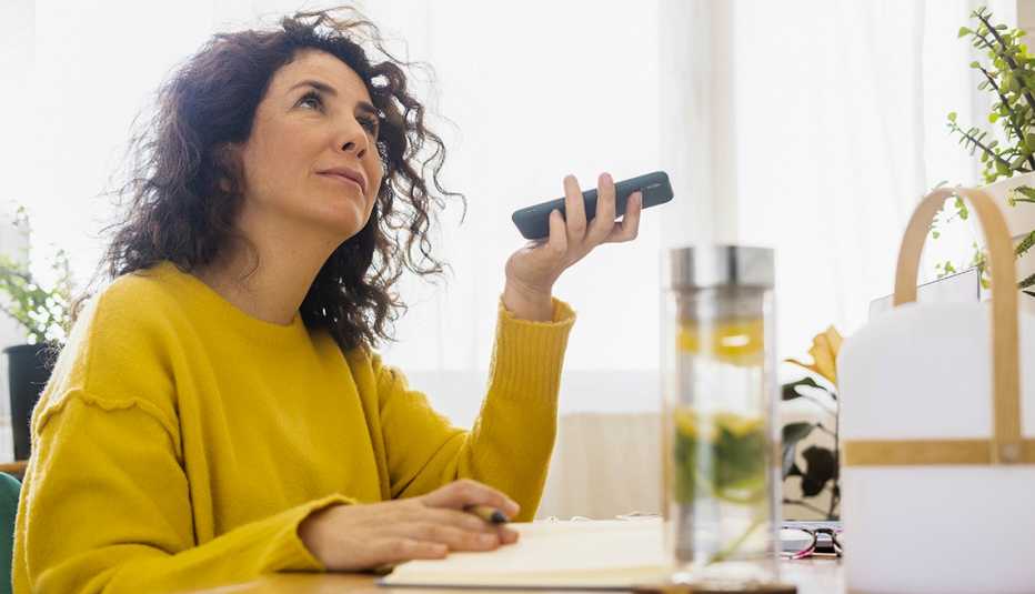Woman listening to a book on her Iphone