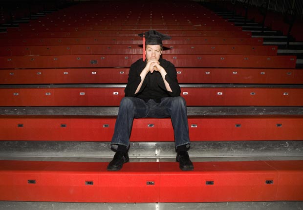 Student sits in bleachers, Private student loans are bad to co-sign