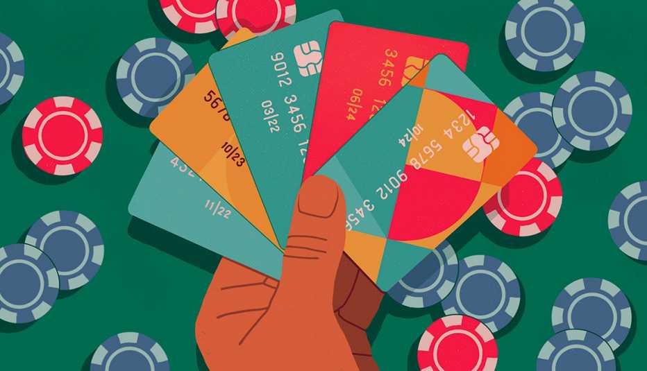 a hand holding a fan of credit cards overlaid on a poker table with chips in the background