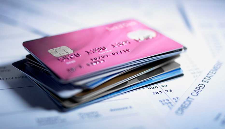 stack of credit cards and credit card bills 