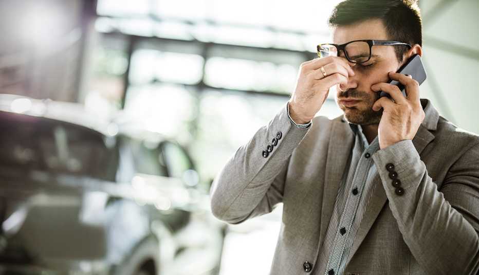 a man looks annoyed after taking a phone call