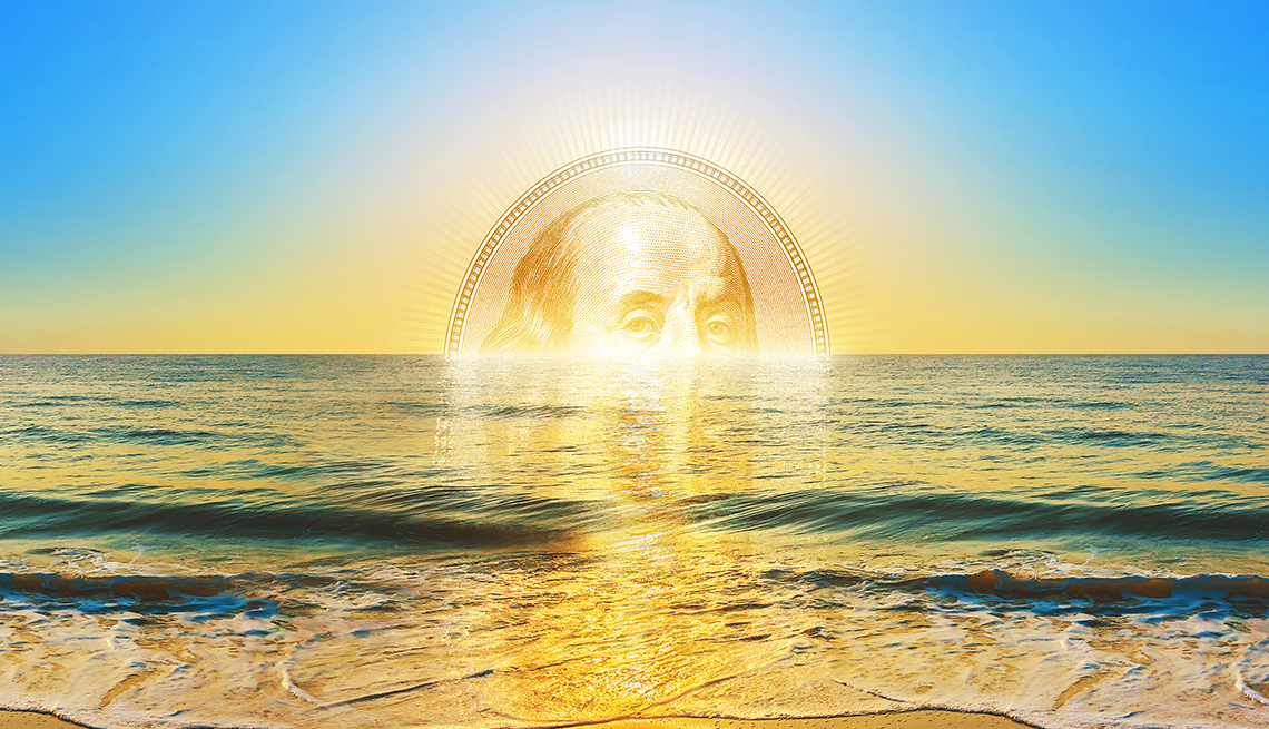 morning sunrise over the ocean with the center of a  hundred dollar bill on the horizon