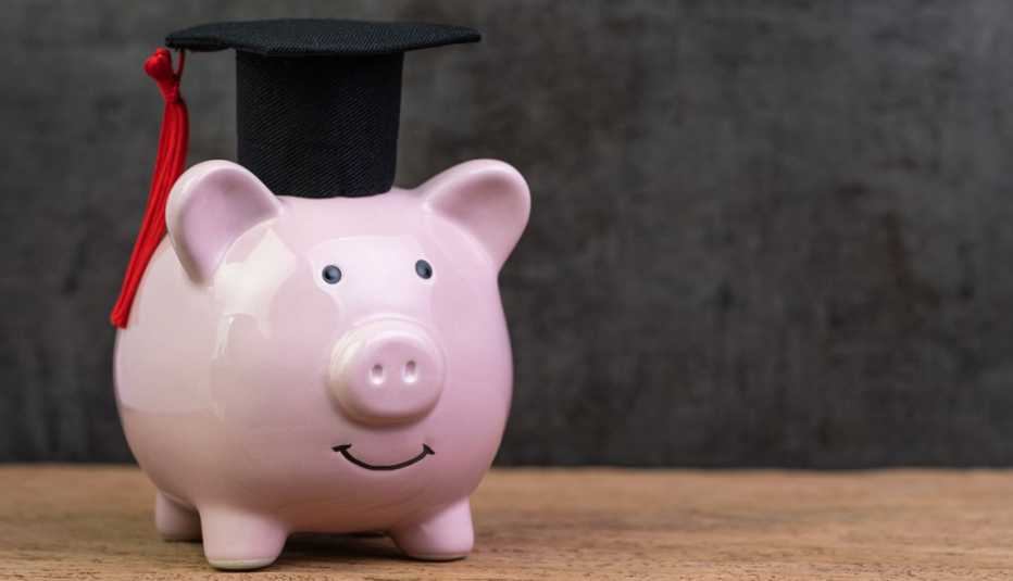 a piggy bank wearing a graduation cap