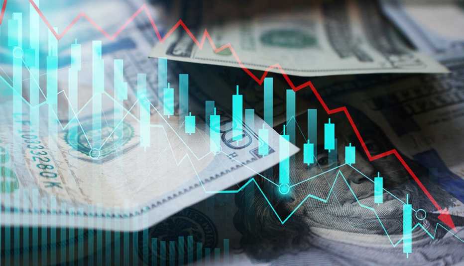 an illustration of financial graphics that show a downward direction, superimposed over U.S. currency in the background