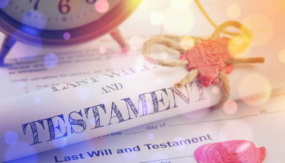 Vintage style impression of a last will and testament scroll that is fastened with twine and a wax seal. A soft-focus display of a vintage last will and testament that is rolled up and fastened with twine and a wax seal.