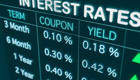 backlit board showing bond yields and coupons