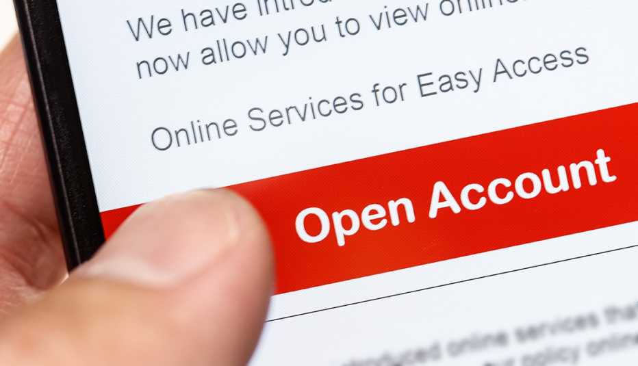 closeup of someone using a mobile phone to open an online bank account