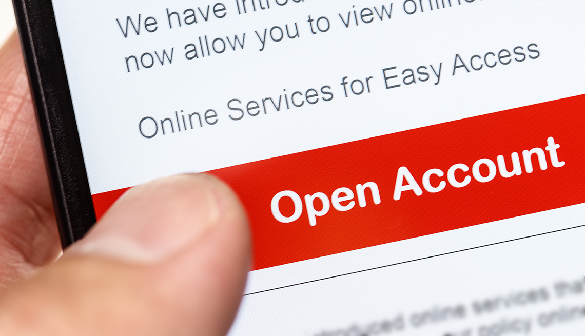 closeup of someone using a mobile phone to open an online bank account