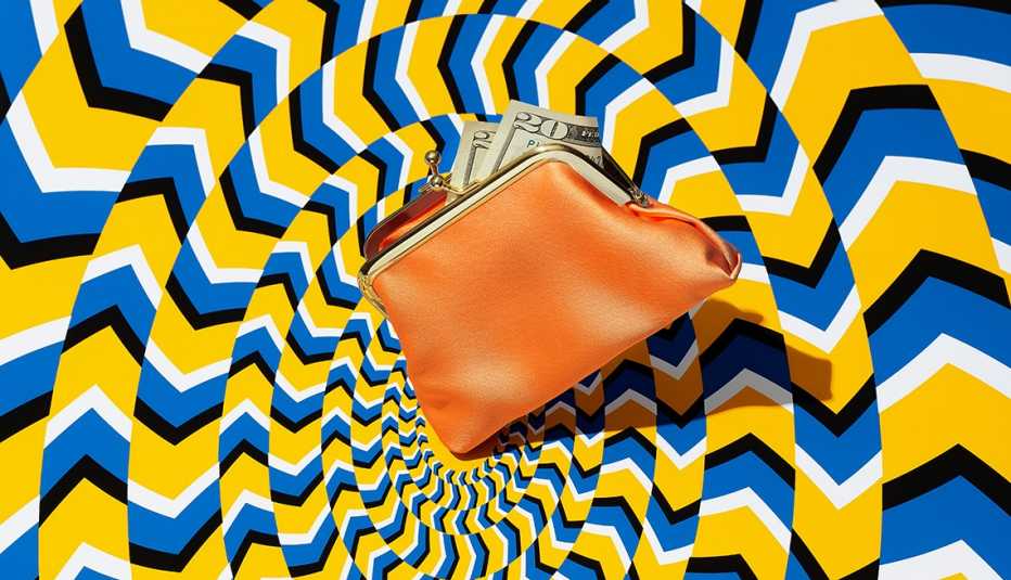 a wallet with bills in it in the middle of a spiral pattern