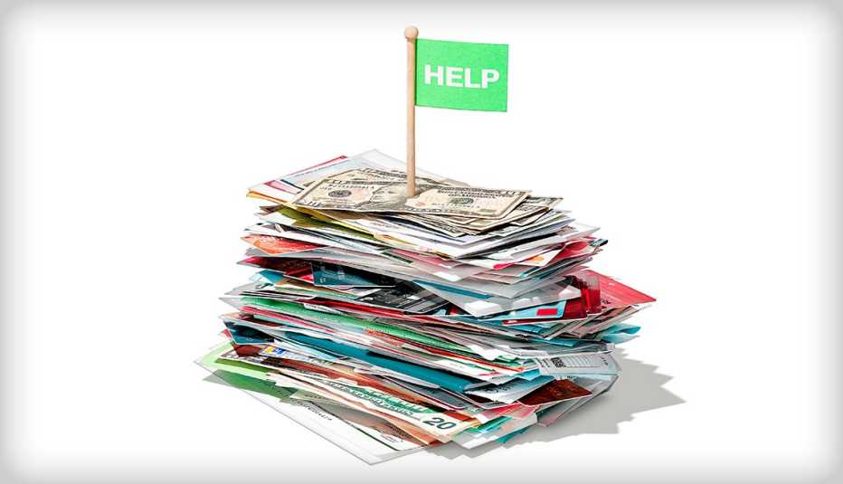 a pile of money with a flag that says help planted on top of the heap