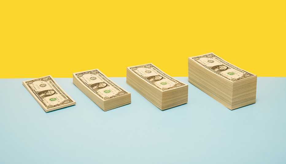 Four stacks of money growing progressively larger