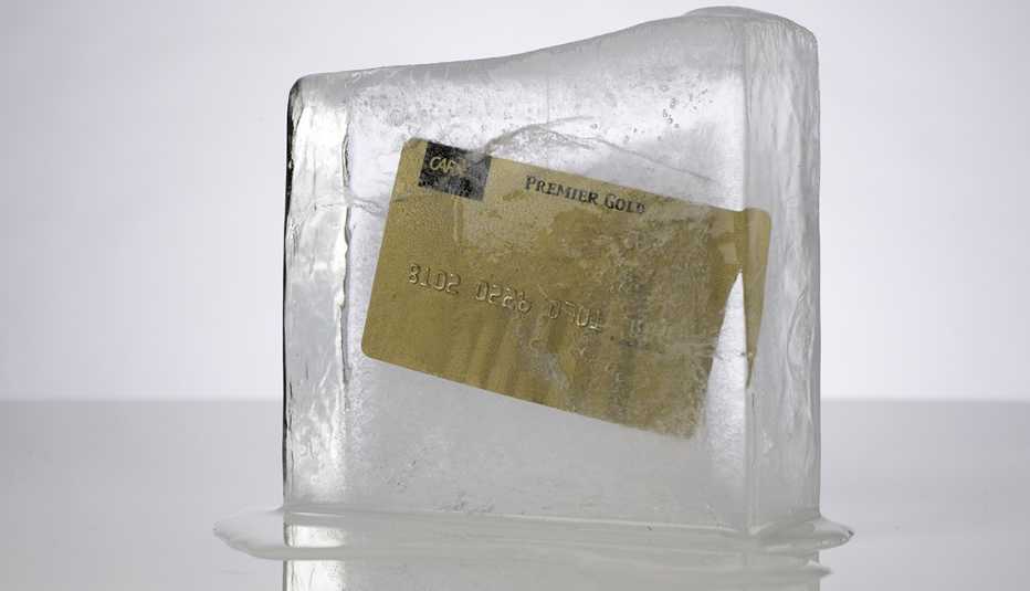 credit card frozen in a block of ice