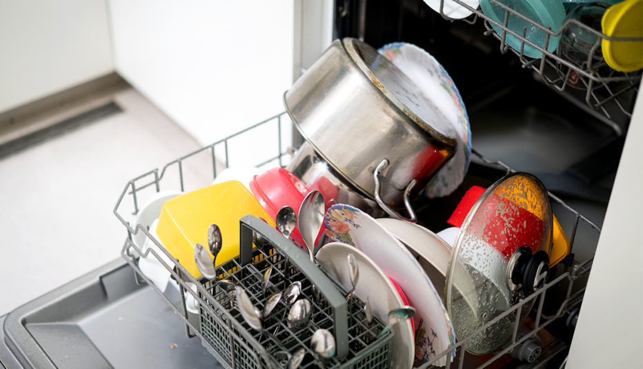 an open and filled dishwasher