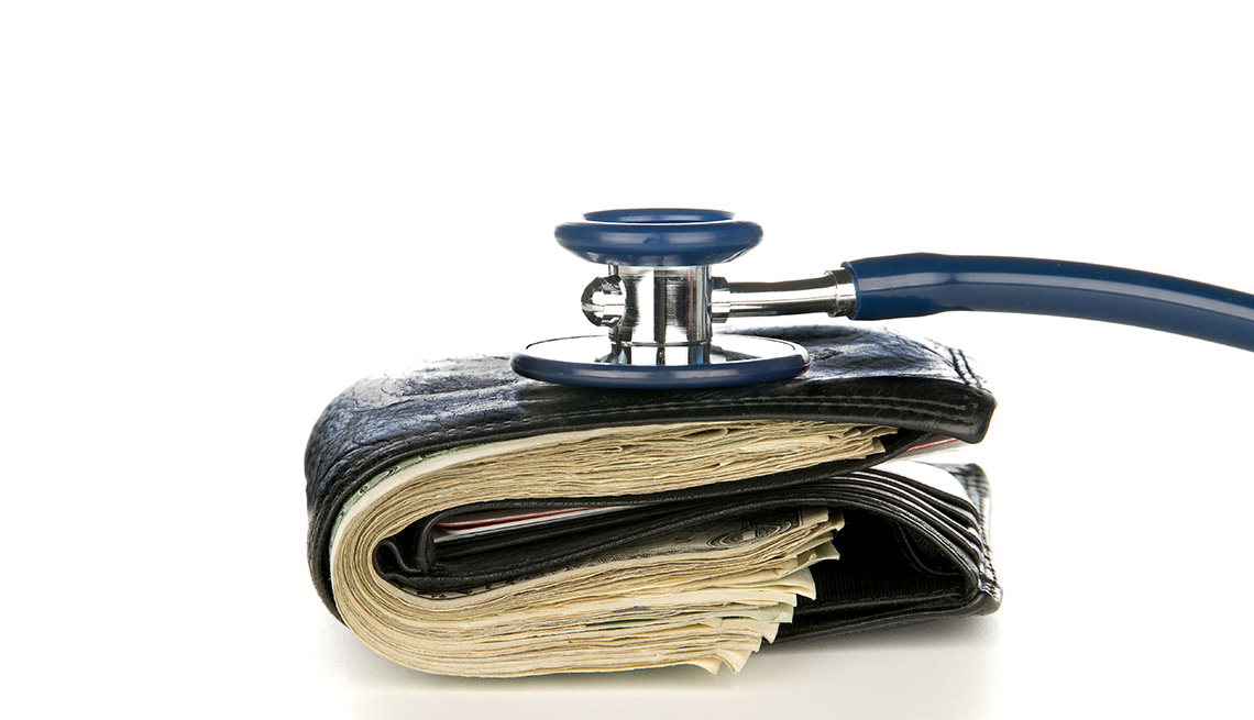 A leather wallet being examined with a stethoscope. Good for medical and financial inferences, high costs, being broke